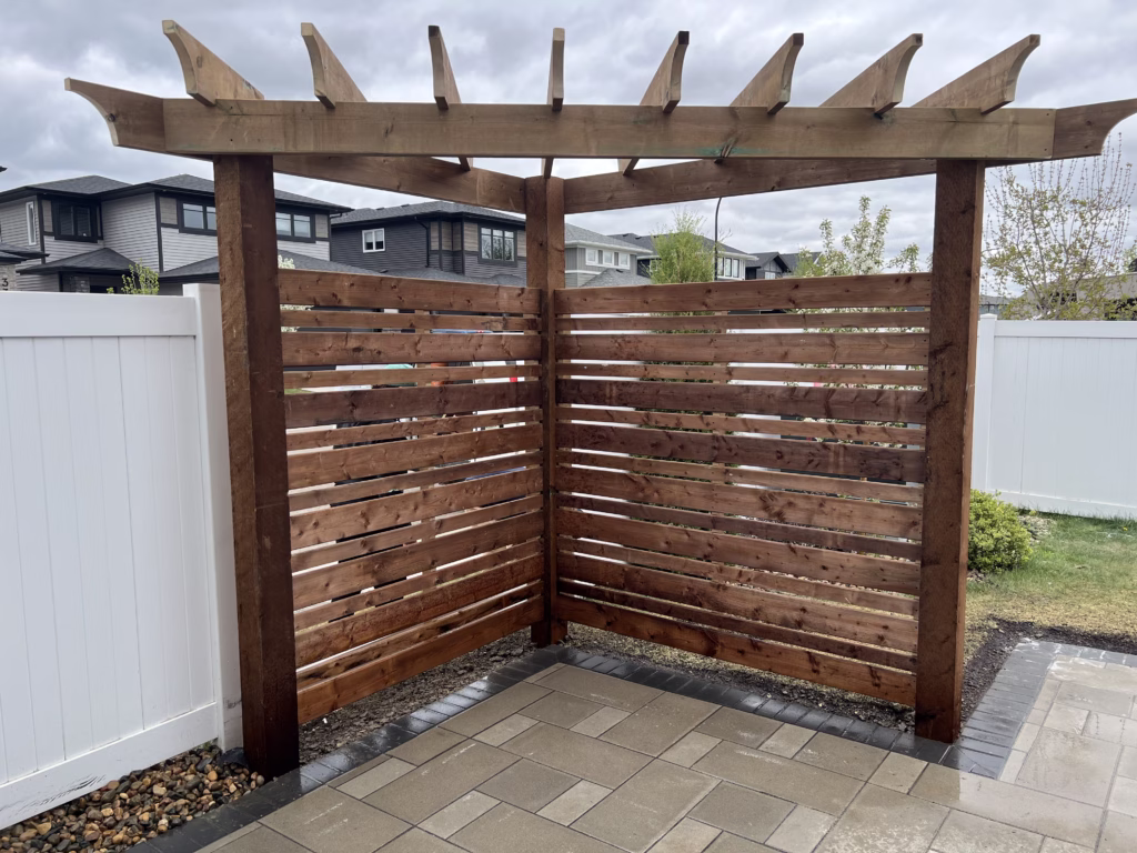 Pressure-treated pergola construction in Saskatoon by MN Fence + Deck