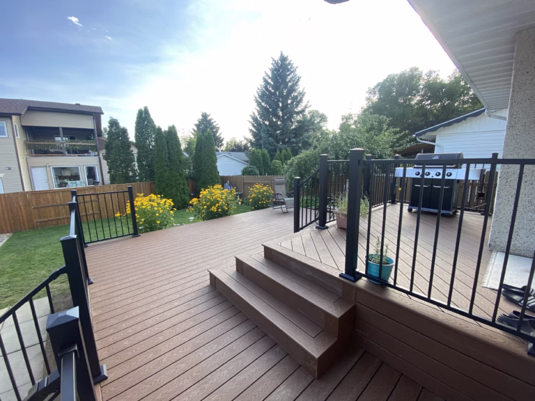 Multi-level composite deck with wrap around stairs